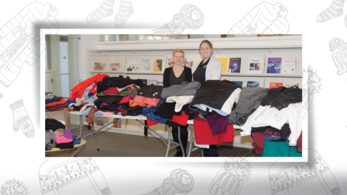 Heather Maloney and Jen Ellis with stacks of donated coats.