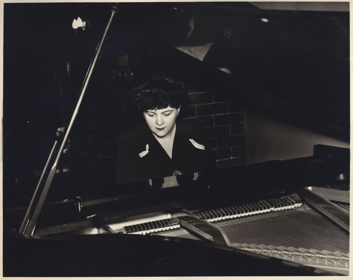 A black and white photo of Dorothy Stolzenbach Payne at the piano